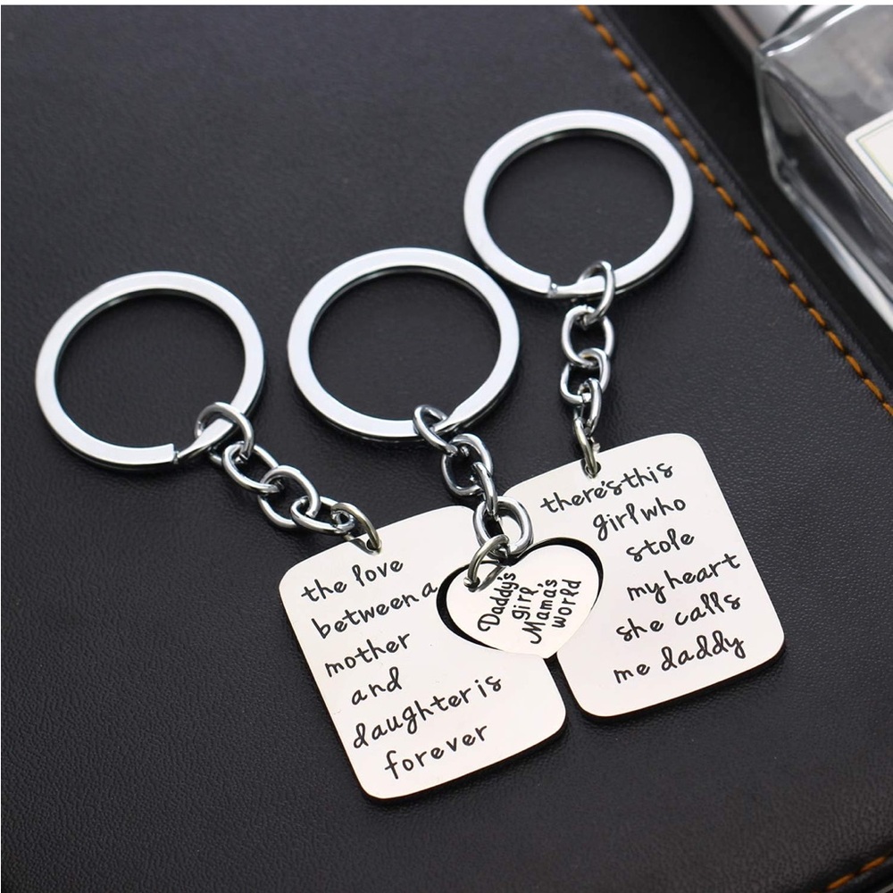 Silver keychain set with engraved messages. Includes a heart charm.